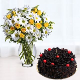 Vase arrangement of white daisies with yellow roses with chocolate fantasy cake 