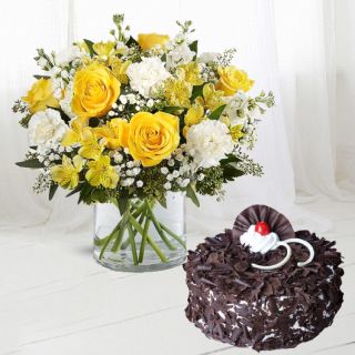 Vase arrangement of yellow roses with white carnations with half kg black forest cool cake 