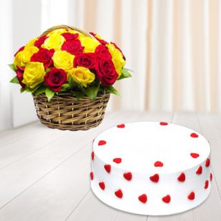 Basket arrangement of 15 red and yellow roses with vanilla cake