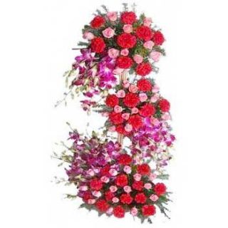 4 feet height exotic arrangement of lilies orchids ,roses and carnations